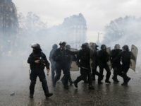 Paris police Police officers walk amidst the teargas after firing it during a demonstration by yellow vest protestors in Paris, Saturday, Jan. 26, 2019. Scattered skirmishes broke out amid mainly peaceful yellow vest marches Saturday in Paris and around France, as the movement kept up pressure on President Emmanuel Macron despite internal …