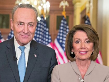 Senate Minority Leader Chuck Schumer of N.Y., and House Speaker Nancy Pelosi of Calif., po