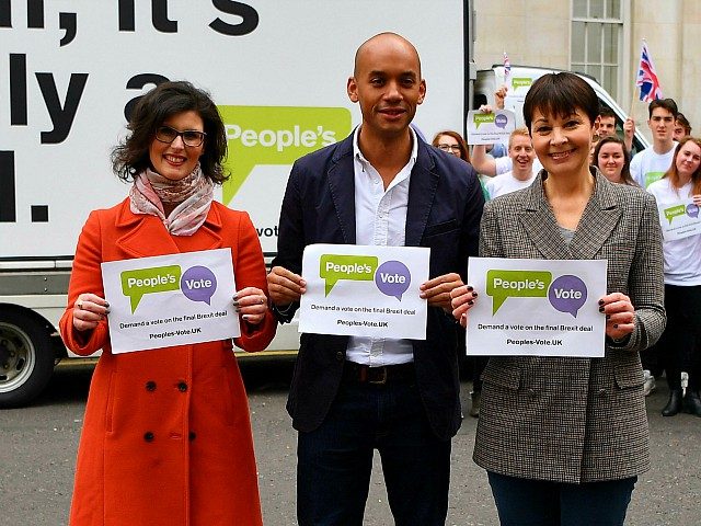 British politicians, Labour Party MP Chuka Umunna (C), Liberal Democrat MP Layla Moran (L) and Green MP Caroline Lucas (R) pose in front of an advertising board to launch the Peoples Vote advertising campaign in central London on April 15, 2018 calling for a referendum on the final Brexit deal. …