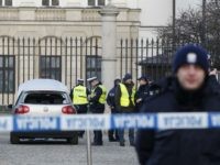 Police officers examine a car in the driveway to the Presidential Palace in Warsaw, Poland, Tuesday, Jan. 22, 2019 after a man rammed the car into a metal barrier protecting the driveway. The man was driving the wrong way and hit a policeman who was trying to stop him before …