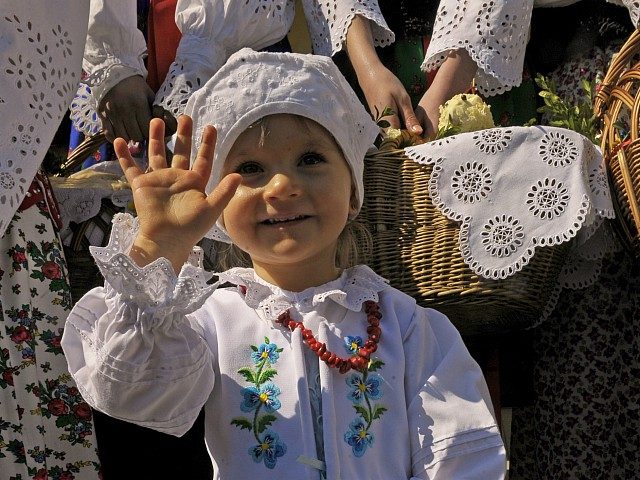 A Polish child arrives for an Easter Saturday blessing in a church in Bialy Dunajec on Apr