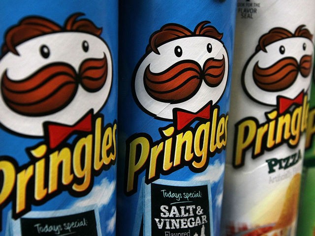 Packages of Pringles potato chips are displayed on a shelf at a market on April 5, 2011 in