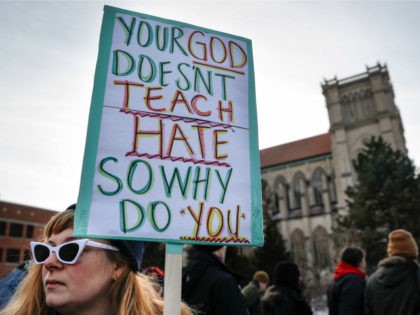 Protestors gather outside the Catholic Diocese of Covington Tuesday, Jan. 22, 2019, in Covington, Ky. The diocese in Kentucky has apologized after videos emerged showing students from Covington Catholic High School mocking Native Americans outside the Lincoln Memorial on Friday after a rally in Washington. (AP Photo/John Minchillo)