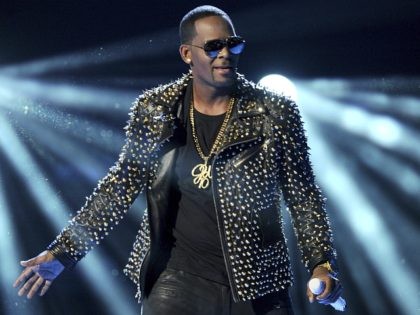 In this June 30, 2013 file photo, R. Kelly performs at the BET Awards in Los Angeles. Spot