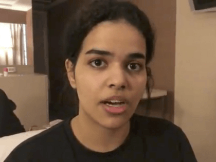 In this Monday, Jan. 7, 2019, image made from video released by Rahaf Mohammed Alqunun/Human Rights Watch, Rahaf Mohammed Alqunun views her mobile phone as she sits barricaded in a hotel room at an international airport in Bangkok, Thailand. Alqunun says she is fleeing abuse by her family and wants …