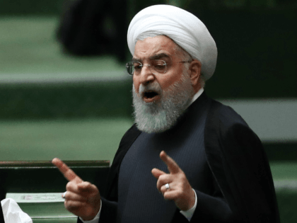 Iranian president Hassan Rouhani speaks to defend his nominations for four ministries during a parliament session in Tehran, on October 27 2018. - The Iranian parliament held a special session to approve four new ministers covering the portfolios of economy, transport, labour and industry. The previous economy and labour ministers …