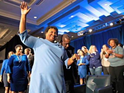 Georgia Democratic gubernatorial candidate Stacey Abrams leaves the stage after addressing supporters during an election night watch party, Tuesday, Nov. 6, 2018, in Atlanta.