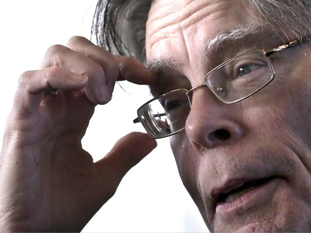 American author Stephen King poses for photographers on November 13, 2013 in Paris, before