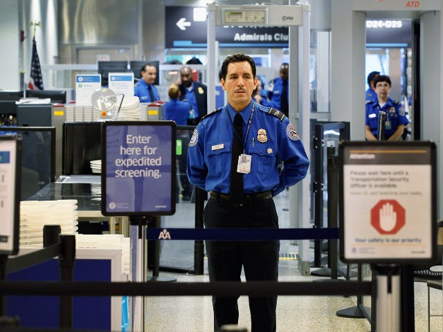 A TSA agent waits for passengers to use the TSA PreCheck lane being implemented by the Transportation Security Administration at Miami International Airport on October 4, 2011 in Miami, Florida. The pilot program launched today for fliers to use the expedited security screening in Miami, Atlanta, Detroit and Dallas/Fort Worth.The …