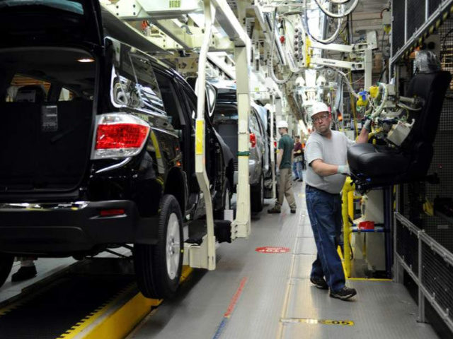 FILE - In this Wednesday, Feb. 8, 2012, file photo, Rick Twitty installs seats into 2012 Toyota Highlander vehicles at the Toyota Motor Manufacturing Indiana, Inc., plant in Princeton, Ind. On Tuesday, Jan. 24, 2017, Toyota said it will add 400 jobs and invest $600 million at the Princeton SUV …