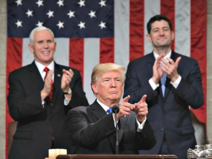 Trump delivers the State of the Union address as Pence and Ryan look on in the House chamber.