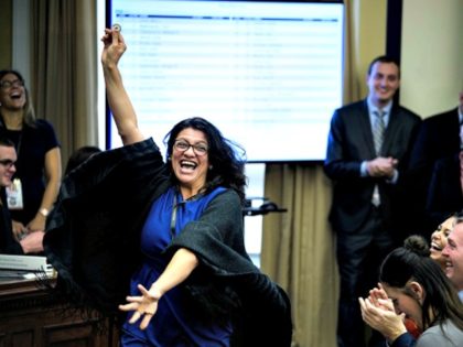 US Representative-elect Rashida Tlaib (D-MI) reacts to a good number during an office lott