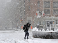 US-Weather-Storm A man makes his way through the storm in Boston during a March noreaster snow storm on March 13, 2018 in Boston, Massachusetts.