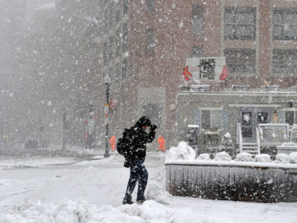 A man makes his way through the storm in Boston during a March noreaster snow storm on Mar