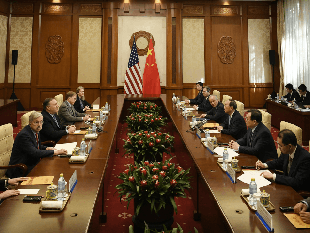 BEIJING, CHINA - OCTOBER 08: U.S. Secretary of State Mike Pompeo (L) speaks with State Cou