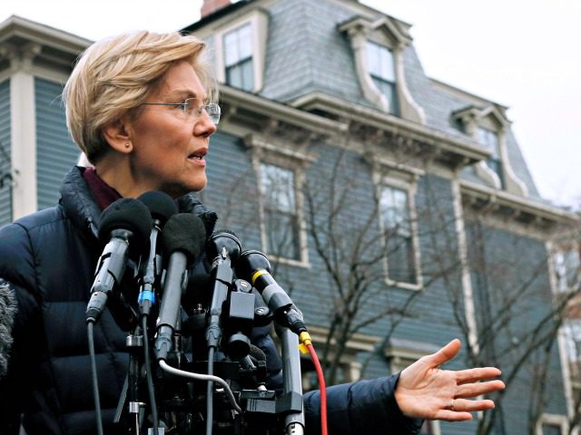 Sen. Elizabeth Warren, D-Mass., speaks outside her home, Monday, Dec. 31, 2018, in Cambridge, Mass. Warren on Monday took the first major step toward launching a widely anticipated campaign for the presidency, hoping her reputation as a populist fighter can help her navigate a Democratic field that could include nearly …