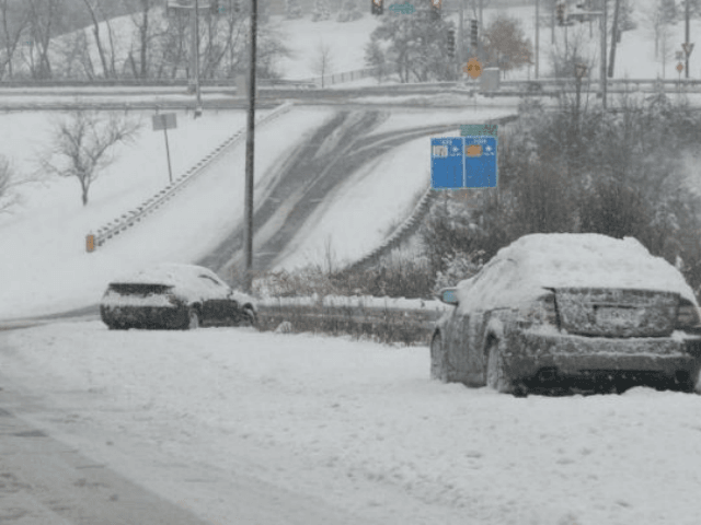 Abandoned cars litter the streets in St. Louis on Saturday. A winter storm that pounded St