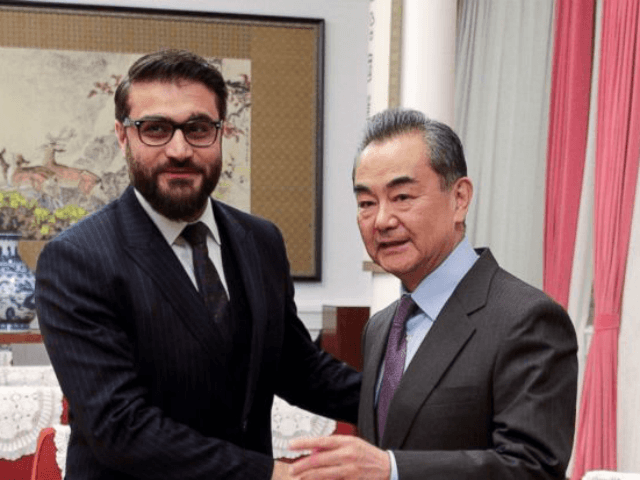 Afghanistan National Security Advisor Hamdullah Mohib, left, shakes hands with Chinese Foreign Minister Wang Yi before proceeding to their meeting at the Zhongnanhai Leadership Compound in Beijing, Thursday, Jan. 10, 2019. (AP Photo/Andy Wong, Pool)