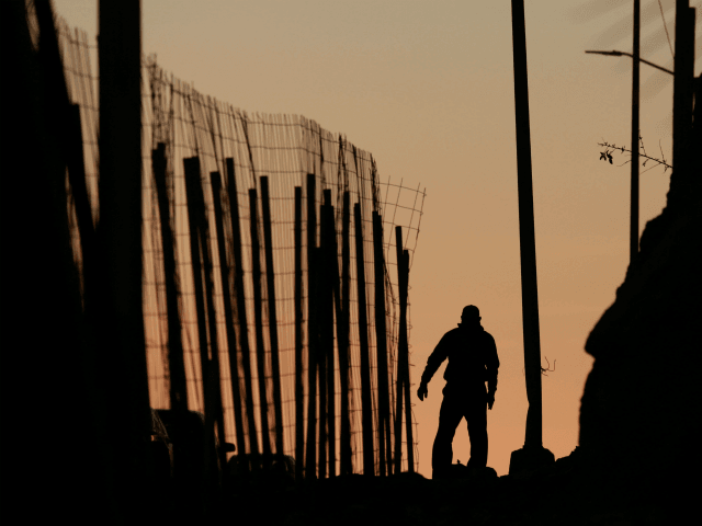A man walks along a road next to the U.S.-Mexico border wall on January 7, 2019 in Tijuana, Mexico. President Donald Trump, who is planning on visiting the border on Thursday, is considering declaring a national emergency if Democrats do not approve of 5.7 billion dollars in funding to build …