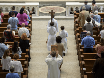 PITTSBURGH, PA - AUGUST 15: Parishioners worship during a mass to celebrate the Assumption of the Blessed Virgin Mary at St Paul Cathedral, the mother church of the Pittsburgh Diocese on August 15, 2018 in Pittsburgh, Pennsylvania. The Pittsburgh Diocese was rocked by revelations of abuse by priests the day …