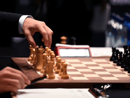 Chess grandmaster and current world chess champion Magnus Carlsen of Norway moves a piece