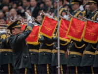 Members of a military band play the national anthem during the fifth plenary session of the first session of the 13th National People's Congress (NPC) at the Great Hall of the People in Beijing on March 17, 2018. China's rubber-stamp parliament unanimously handed President Xi Jinping a second term on …