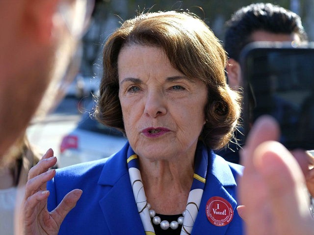 U.S. Sen. Dianne Feinstein talks with reporters after dropping off her vote-by-mail ballot