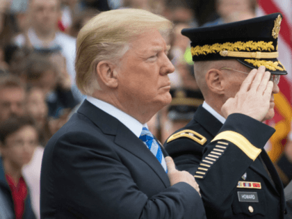 US President Donald Trump (L) and Defense Secretary Jim Mattis (3rd L) mark Memorial Day by laying a wreath at the Tomb of the Unknown Soldier at Arlington National Cemetery in Arlington, Virginia, on May 28, 2018 (Photo by JIM WATSON / AFP) (Photo credit should read JIM WATSON/AFP/Getty Images)