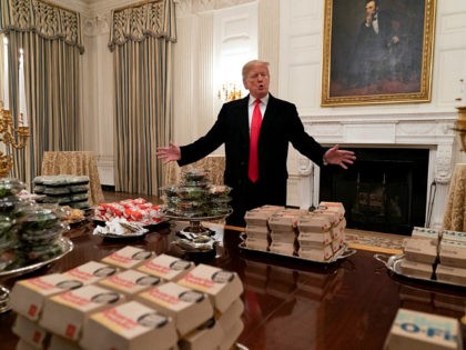WASHINGTON, DC - JANUARY 14: (AFP OUT) U.S President Donald Trump presents fast food to be served to the Clemson Tigers football team to celebrate their Championship at the White House on January 14, 2019 in Washington, DC. (Photo by Chris Kleponis-Pool/Getty Images)