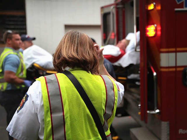 ROCKFORD, IL - JULY 14: Firefighters transport an overdose victim to a hospital on July 14