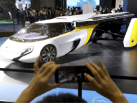 flying car A visitor takes a photo of the Aeromobil, a flying car from Slovakia, during the China International Import Expo in Shanghai, Monday, Nov. 5, 2018. Chinese President Xi Jinping has promised to open China's market wider as he opened a trade fair meant to promote the country's image as an …