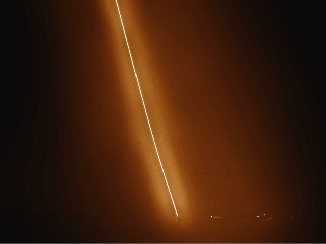 A picture taken on November 12, 2018 with a slow shutter speed shows an Israeli Iron Dome