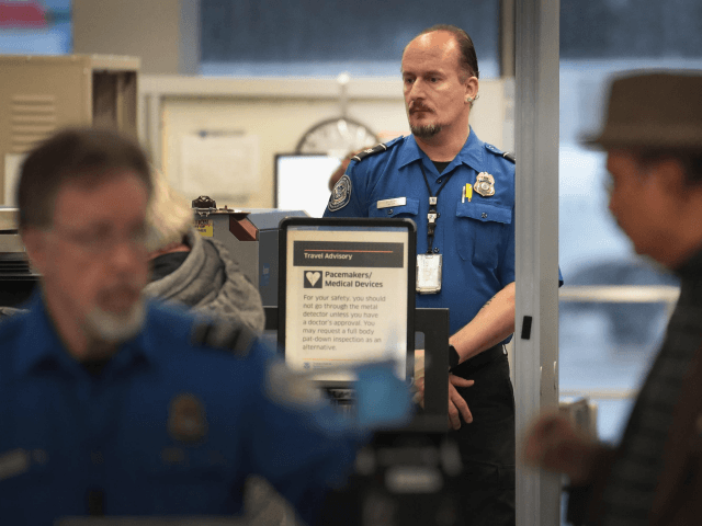 CHICAGO, ILLINOIS - JANUARY 07: A Transportation Security Administration (TSA) worker screens passengers and airport employees at O'Hare International Airport on January 07, 2019 in Chicago, Illinois. TSA employees are currently working under the threat of not receiving their next paychecks, scheduled for January 11, because of the partial government …