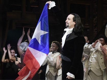 Lin-Manuel Miranda, composer and creator of the award-winning Broadway musical, Hamilton, proudly waves a Puerto Rican flag after receiving a standing ovation at the end of the play's premiere held at the Santurce Fine Arts Center, in San Juan, Puerto Rico, Friday, Jan. 11, 2019. The musical is set to …