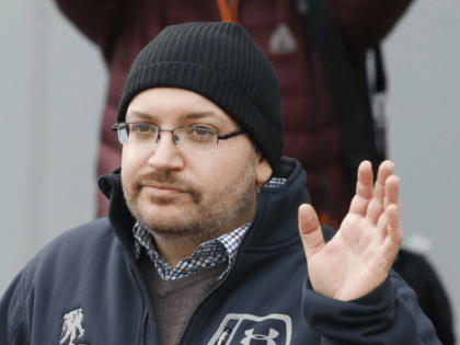 In this Jan. 20, 2016, file photo, Washington Post reporter Jason Rezaian waves at Landstuhl Regional Medical Center in Landstuhl, Germany. Rezaian says he was arrested by Iranian authorities, subjected to a sham trial and held for 18 months purely as a way to gain leverage over the American government …