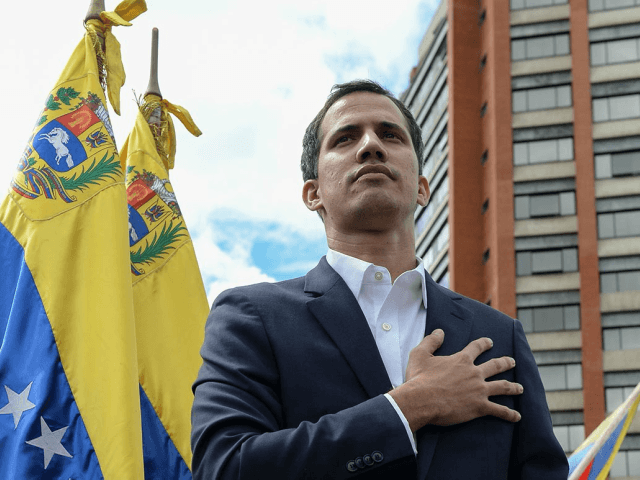 Venezuela's National Assembly head Juan Guaido declares himself the country's "acting president" during a mass opposition rally against leader Nicolas Maduro, on the anniversary of the 1958 uprising that overthrew military dictatorship, in Caracas on Wednesday. | Federico Parra/AFP/Getty Images
