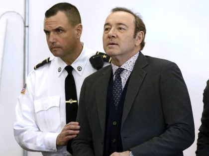 Actor Kevin Spacey enters the courtroom at district court for arraignment on a charge of indecent assault and battery on Monday, Jan. 7, 2019, in Nantucket, Mass. The Oscar-winning actor is accused of groping the teenage son of a former Boston TV anchor in 2016 in the crowded bar at …