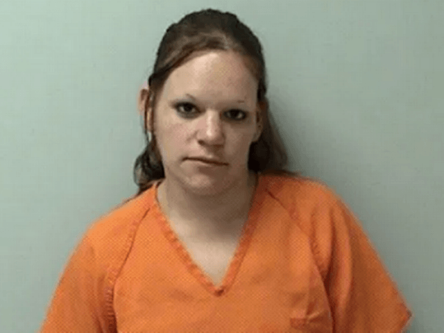 Police have charged an American babysitter with murder after she allegedly wrapped a dead