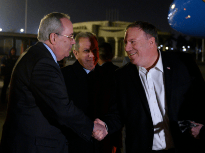 US Secretary of State Mike Pompeo (C) and his wife Susan (R) are greeted by Assistant Fore