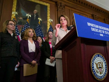 House Speaker Nancy Pelosi of Calif., center, speaks accompanied by gun violence victim former Rep. Gabby Giffords, left, Rep. Lucy McBath, D-Ga., and Shannon Watts, who founded Moms Demand Action, second from right, to announce the introduction of bipartisan legislation to expand background checks for sales and transfers of firearms, …