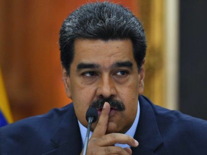 Venezuela's President Nicolas Maduro speaks gestures during a press conference, where he warned the Lima Group that he would take energetic measures if they do not rectify their position on Venezuela in 48 hours, on the eve of assuming a new six-year mandate, at the Miraflores presidential palace in Caracas, …