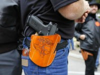 open-carry-handgun-holster-texas-file-getty AUSTIN, TX - JANUARY 1: On January 1, 2016, the open carry law took effect in Texas, and 2nd Amendment activists held an open carry rally at the Texas state capitol on January 1, 2016 in Austin, Texas. (Photo by Erich Schlegel/Getty Images)