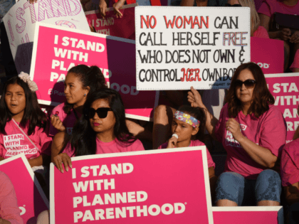 Supporters and patients of Planned Parenthood take part in a 'Pink the Night Out' rally at City Hall, which is part of a nationwide series of actions in support of the organization and in opposition to US President Donald Trump's health care proposal, in Los Angeles, California on June 21, …