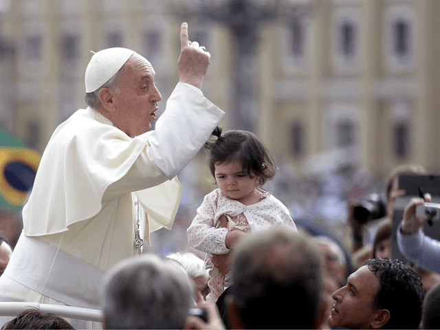 Pope Francis gestures upon his arrival in St Peter's square at the Vatican on September 11, 2013, for his weekly general audience. AFP PHOTO / FILIPPO MONTEFORTE (Photo credit should read FILIPPO MONTEFORTE/AFP/Getty Images)