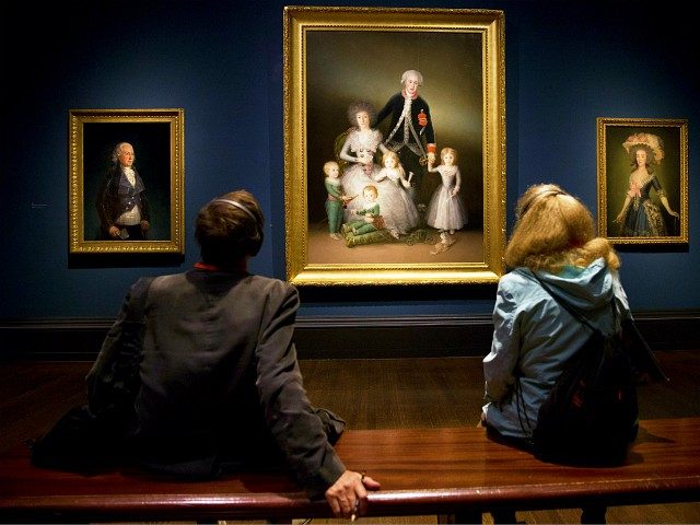 Visitors look at paintings 'The Duke of Osuna around 1795' (L), 'The Duke and Duchess of O