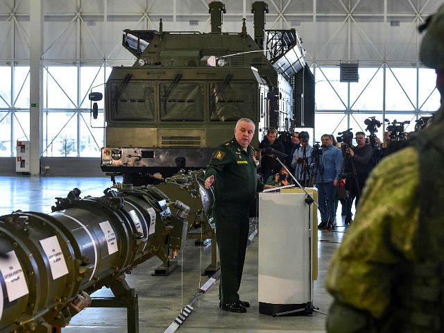 Russian Defence Ministry officials show off the Russia's 9M729 cruise missile at the milit