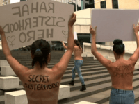 secret sisterhood SYDNEY (AP) — Four women held a topless protest in Sydney on Thursday to support runaway Saudi woman Rahaf Mohammed Alqunun, as Australia began considering her bid to settle in the country as a refugee.