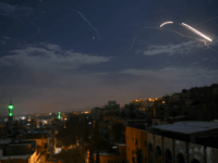 syria air defenses A picture taken early on January 21, 2019 shows Syrian air defence batteries responding to what the Syrian state media said were Israeli missiles targeting Damascus. - Israel struck what it said were Iranian targets in Syria today in response to rocket fire it blamed on Iran, sparking concerns of …