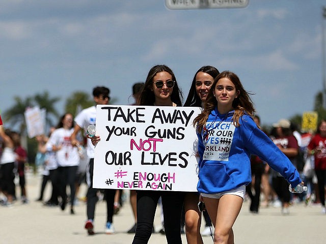 PARKLAND, FL - MARCH 24: Marjory Stoneman Douglas High School students participate in the March For Our Lives event at Pine Trails Park as they walk to the high school on March 24, 2018 in Parkland, Florida. The event was one of many scheduled around the United States calling for …