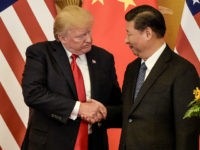 us-donald-trump-china-xi-jinping-shake-hands-flags-AFP US President Donald Trump (L) shakes hand with China's President Xi Jinping at the end of a press conference at the Great Hall of the People in Beijing on November 9, 2017. Donald Trump and Xi Jinping put their professed friendship to the test on November 9 as the least …